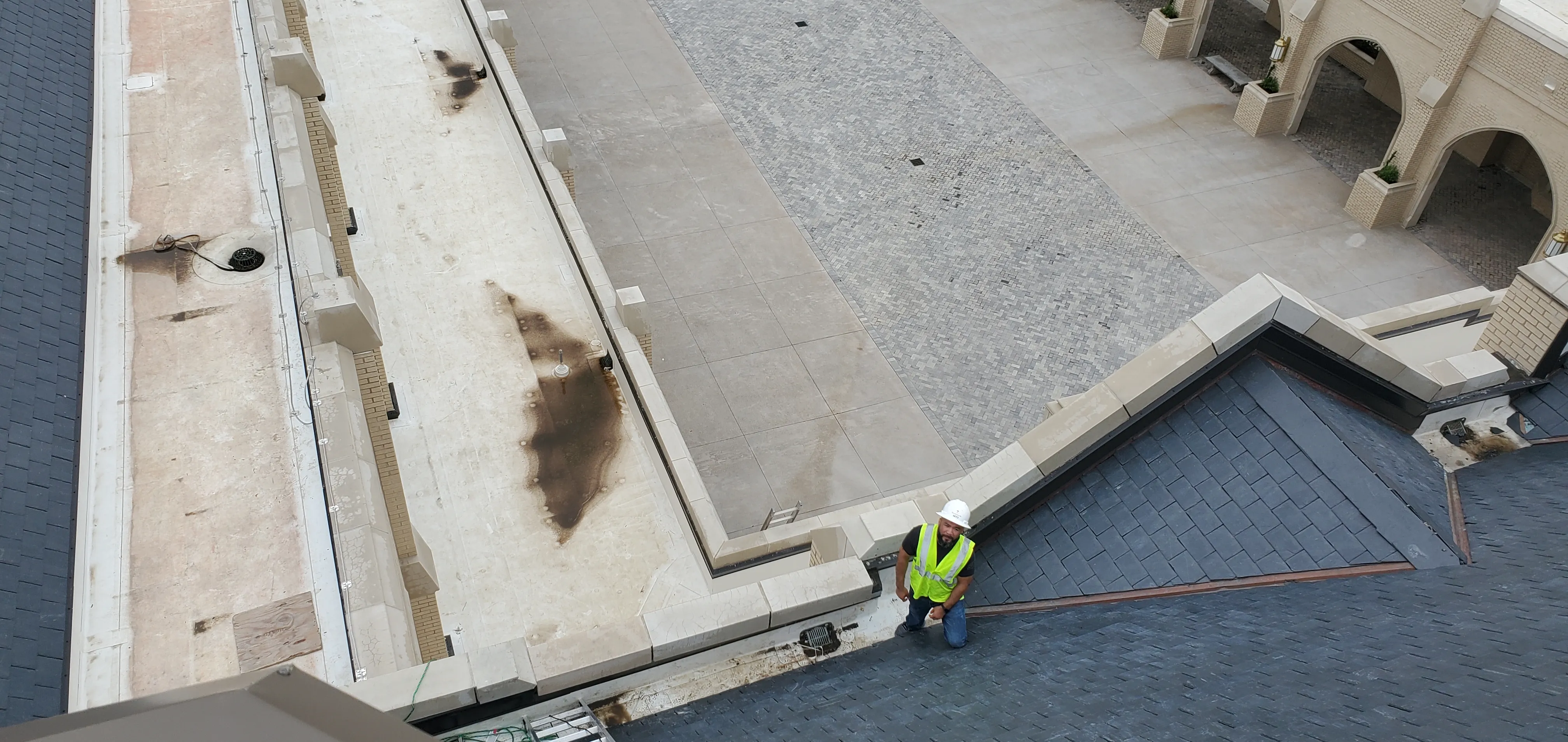Nate Garza on an aerial Chim-Tex roofing job at Park Cities Presbyterian Church in Dallas, approximately 50 feet off the ground